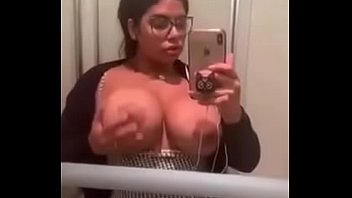 Georgian woman with huge boobs touches herself in front of the mirror in the train restroom