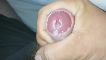 A man jerks his small penis with a huge fist